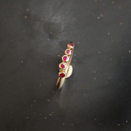 Tiny treasure gold and ruby 5 stone ring handmade by chloe michell jewellery