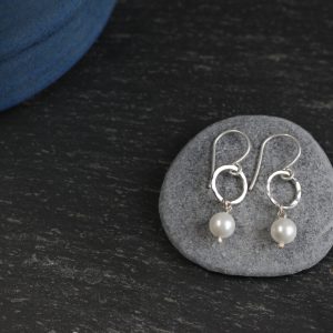 Pearl on hammered sterling silver small hoops made by chloe michell jewellery